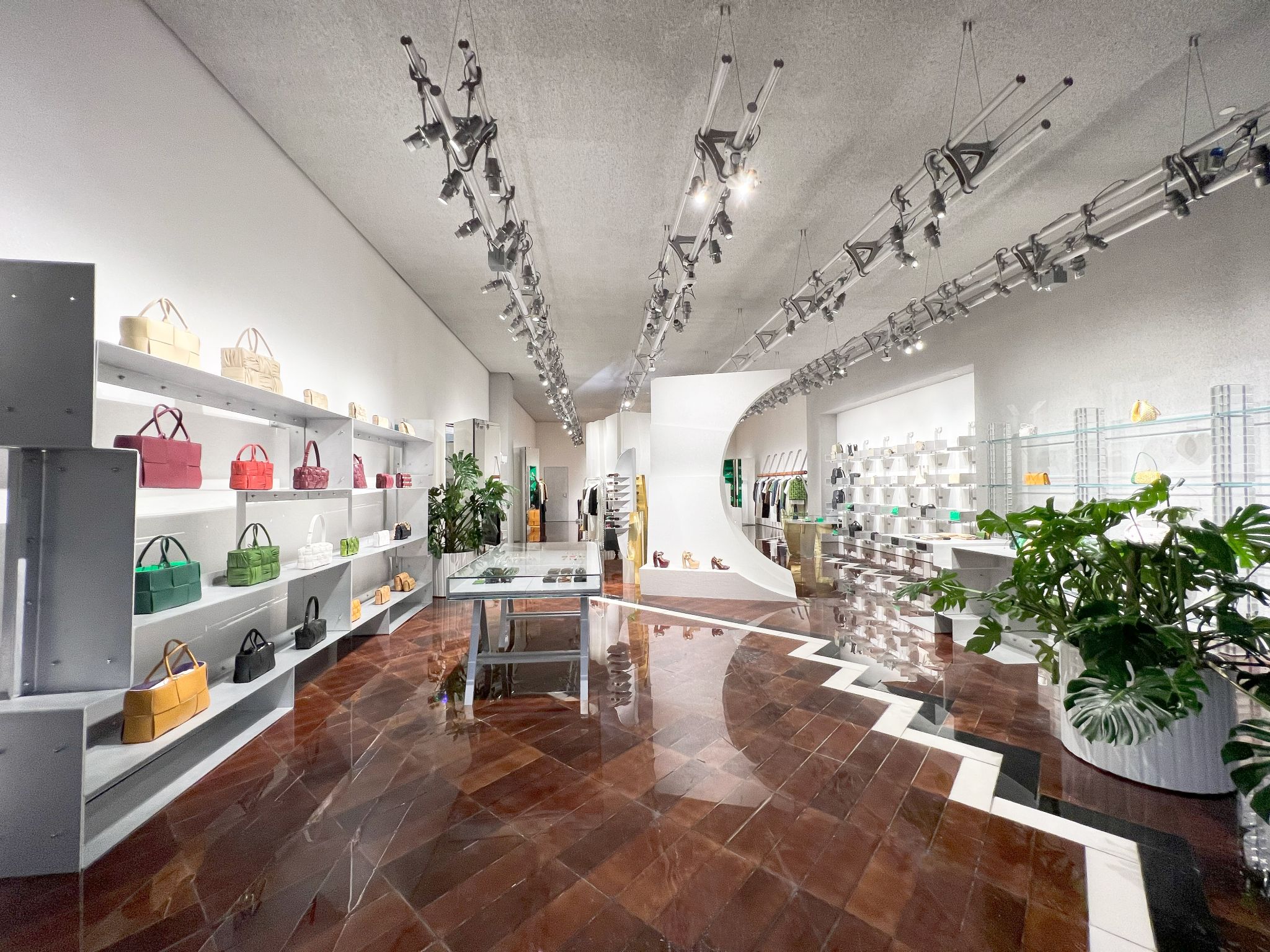 Interior render of Bottega Veneta boutique in Los Angeles, showcasing luxury retail architecture with custom displays, unique lighting, and LEED-certified sustainable design.