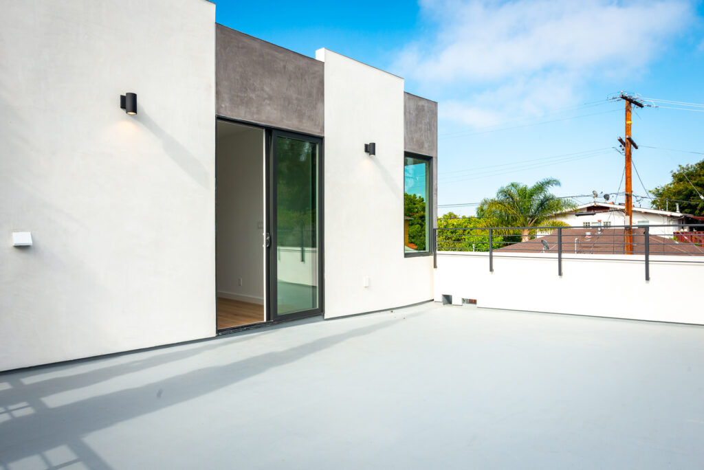 Architectural render detail of pivot door leading to rooftop terrace at Split Shift residences in Los Angeles.