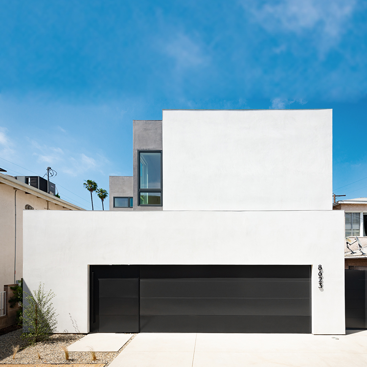 plit Shift home façade, highlighting contemporary design with muted stucco tones and natural wood veneers in Los Angeles.